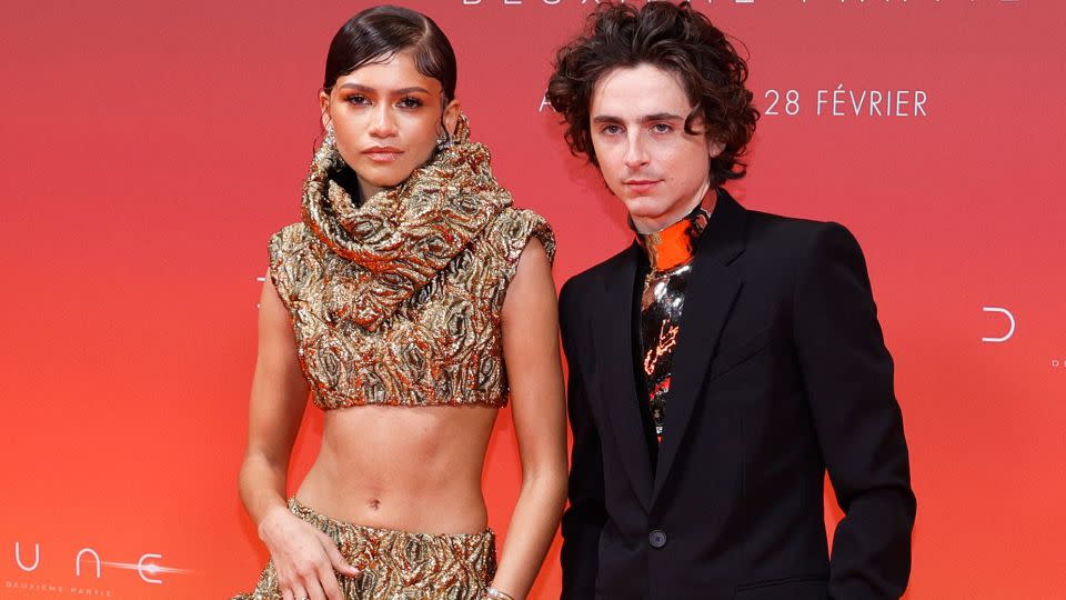 Zendaya in Louis Vuitton and Chalamet in Givenchy Haute Couture at the Paris premiere. - Geoffroy Van Der Hasselt/AFP/Getty Images