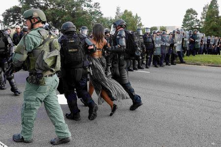 Protestor Ieshia Evans is detained by law enforcement near the headquarters of the Baton Rouge Police Department in Baton Rouge, Louisiana, U.S. July 9, 2016. REUTERS/Jonathan Bachman/File Photo