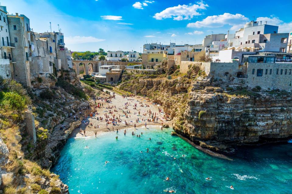 polignano a mare, italy october 1st, 2018 scenic view of lama monachile cala porto beach in polignano a mare, province bari, region puglia, sauthern italy