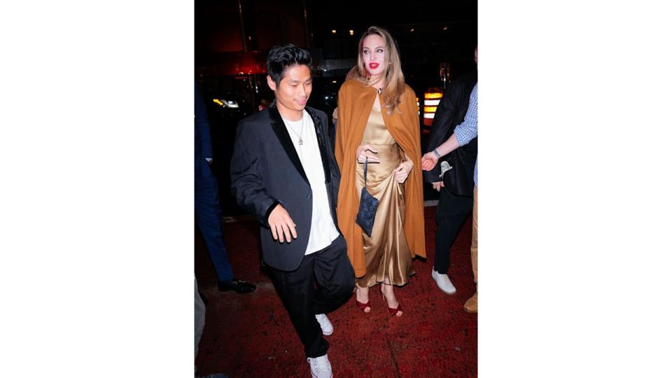 Angelina Jolie and Pax Jolie-Pitt arrive at the afterparty of "The Outsiders" 