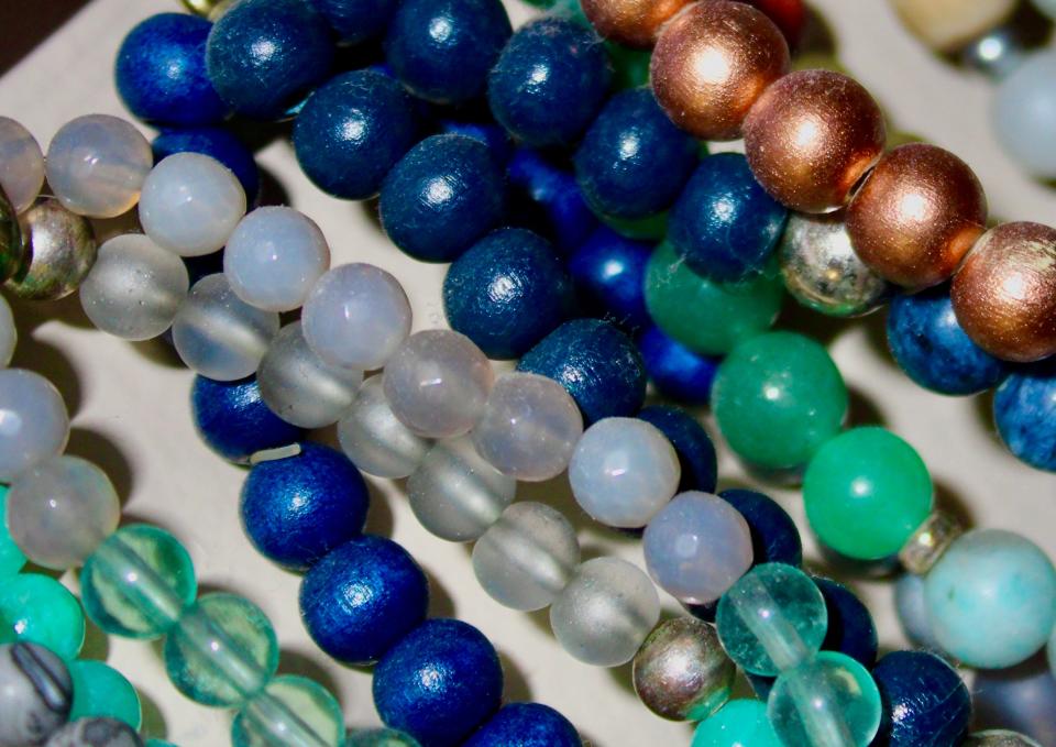 Blue, clear, and bronze beaded bracelet strands