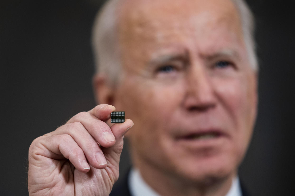 WASHINGTON, DC - FEBRUARY 24: U.S. President Joe Biden holds a semiconductor during his remarks before signing an Executive Order on the economy in the State Dining Room of the White House on February 24, 2021 in Washington, DC.  (Photo by Doug Mills/Pool/Getty Images)