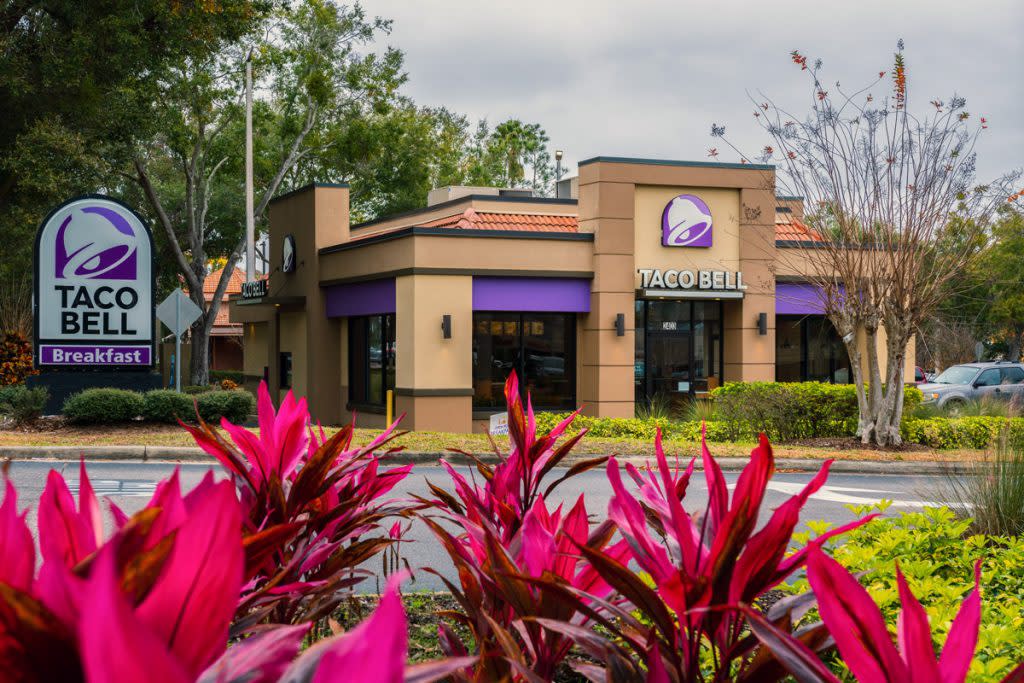 A Taco Bell store is photographed from the outside. 