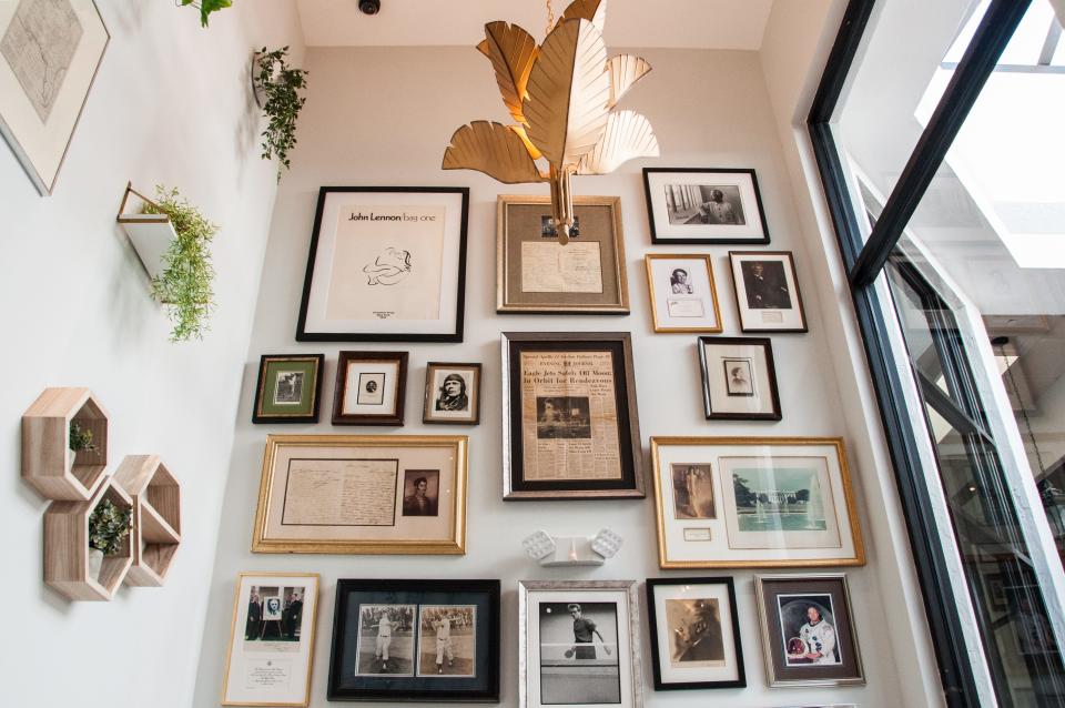 A historical inspiration wall at the new, literary-minded Via Roma Café in Palm Beach.