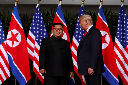 U.S. President Donald Trump and North Korea's leader Kim Jong Un meet at the Capella Hotel on the resort island of Sentosa, Singapore June 12, 2018. REUTERS/Jonathan Ernst