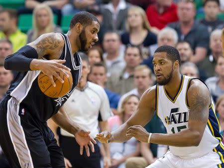 Apr 5, 2016; Salt Lake City, UT, USA; Utah Jazz forward Derrick Favors (15) defends against San Antonio Spurs forward LaMarcus Aldridge (12) during the first quarter at Vivint Smart Home Arena. Mandatory Credit: Russ Isabella-USA TODAY Sports / Reuters Picture Supplied by Action Images