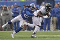 Sep 9, 2018; East Rutherford, NJ, USA; New York Giants defensive back Janoris Jenkins (20) tackles Jacksonville Jaguars running back Leonard Fournette (27) during the first half at MetLife Stadium. Mandatory Credit: Vincent Carchietta-USA TODAY Sports