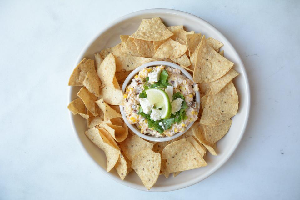 Game time! Slow cookers can be used for a variety of dips, including this spicy corn and jalapeno cheese one.