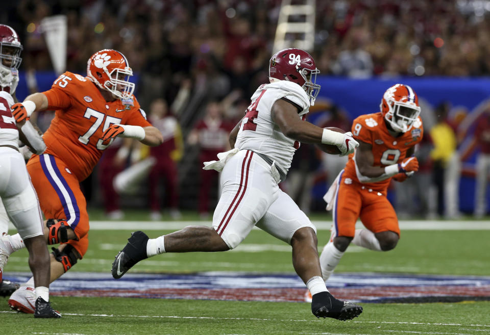 Alabama defensive lineman Da’Ron Payne (94) returns an interception in the second half of the Sugar Bowl semi-final playoff game against Clemson for the NCAA college football national championship, in New Orleans, Monday, Jan. 1, 2018. (AP Photo/Rusty Costanza)