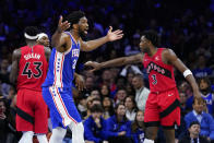 Philadelphia 76ers' Joel Embiid reacts during the first half of Game 5 in an NBA basketball first-round playoff series against the Toronto Raptors, Monday, April 25, 2022, in Philadelphia. (AP Photo/Matt Slocum)