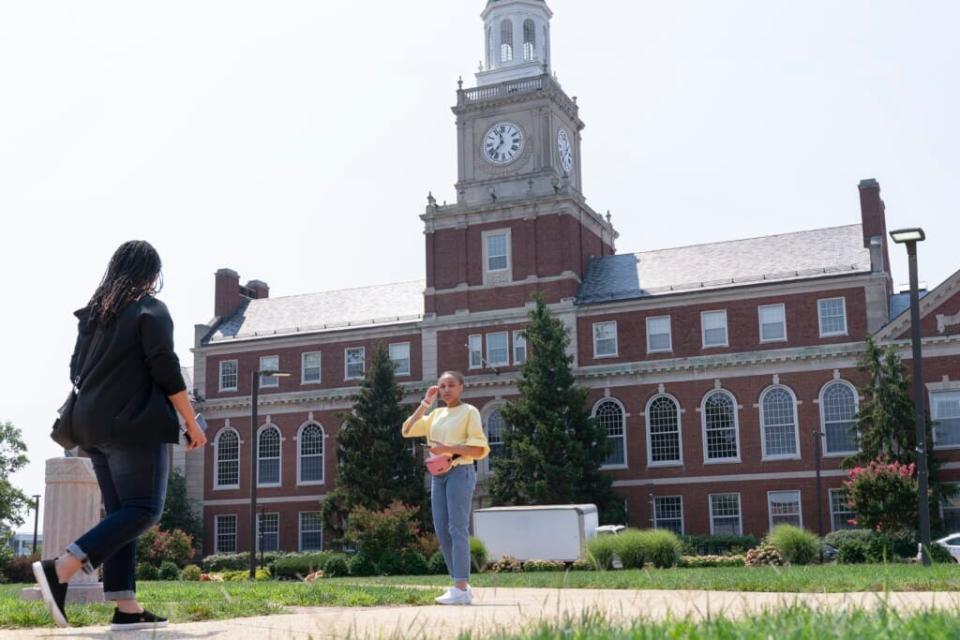 In this July 6, 2021, file photo with the Founders Library in the background, people walk along the Howard University campus in Washington. (AP Photo/Jacquelyn Martin, File)