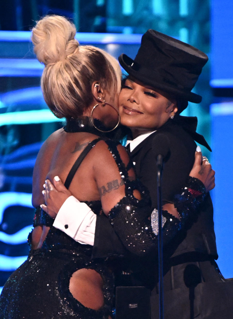 Janet Jackson and Mary J. Blige embrace one another as Jackson presents Blige with Icon Award at the 2022 Billboard Music Awards