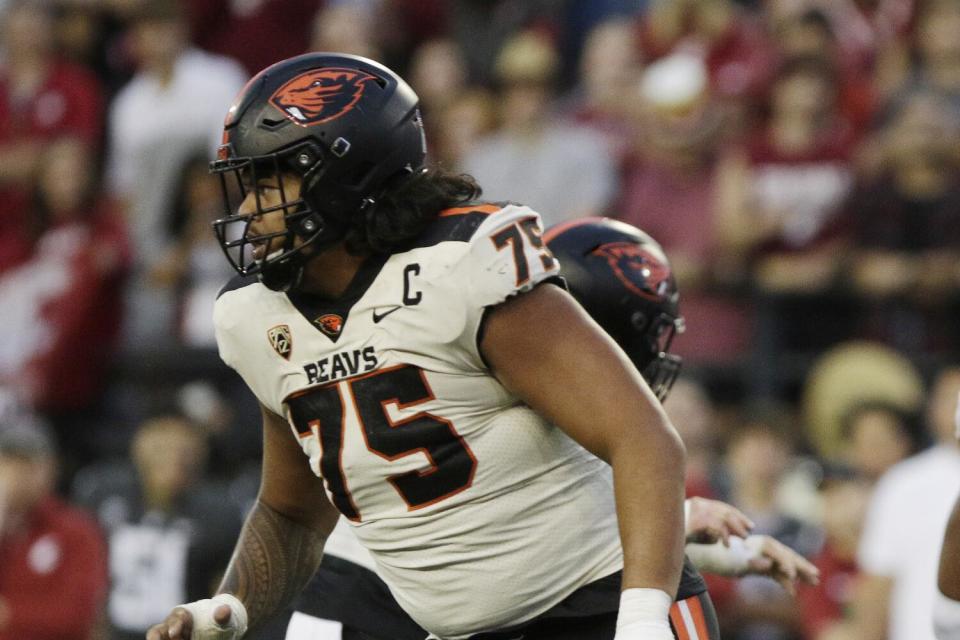 Oregon State offensive lineman Taliese Fuaga follows a play against Washington State.