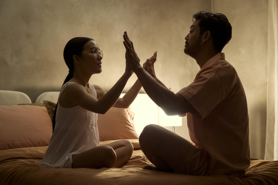 Amy (Ali Wong) and her husband, George (Joseph Lee) attempt an intimacy exercise.<span class="copyright">Andrew Cooper—Netflix</span>