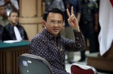 Jakarta's Governor Basuki Tjahaja Purnama gestures inside the courtroom during his blasphemy trial at the North Jakarta District Court in Jakarta, Indonesia, December 27, 2016. REUTERS/Bagus Indahono/Pool