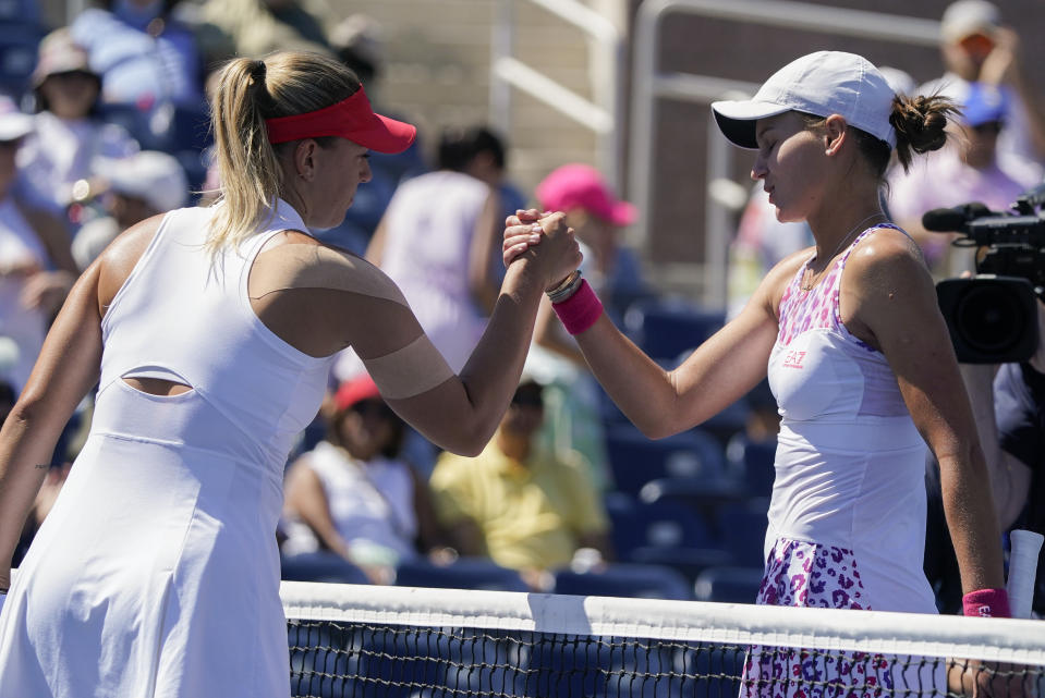 Veronika Kudermetova, of Russia, right, shakes hands with Dalma Galfi, of Hungary, after winning their third round match of the U.S. Open tennis championships, Friday, Sept. 2, 2022, in New York. (AP Photo/John Minchillo)