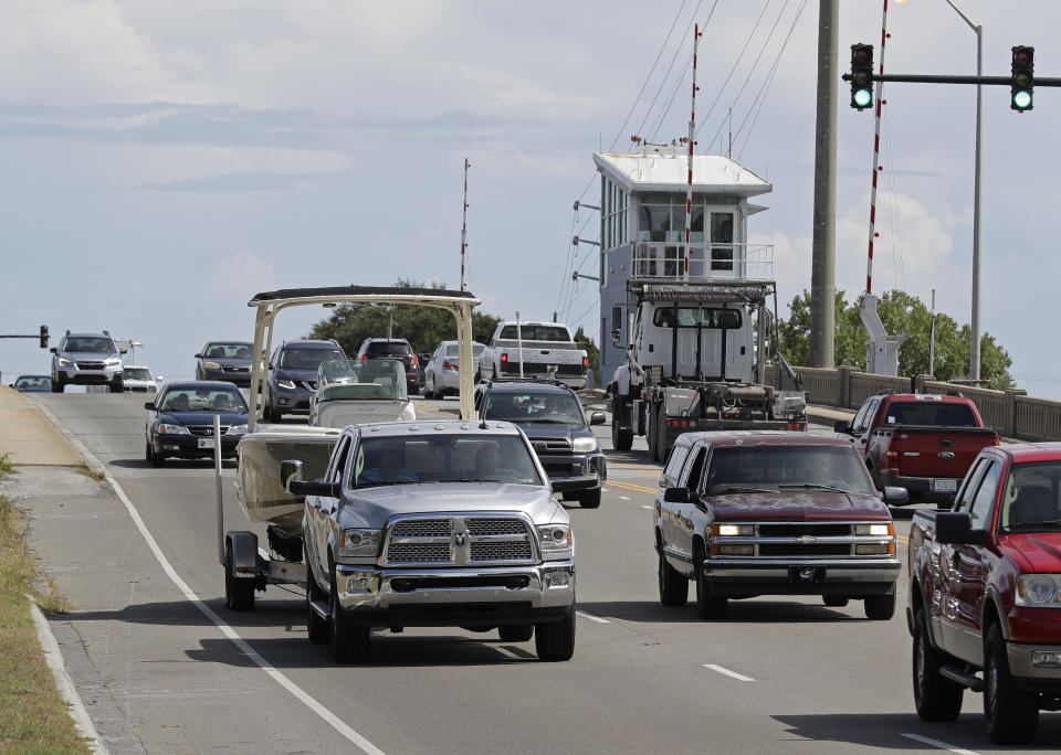 People drive over a drawbridge in Wrightsville Beach