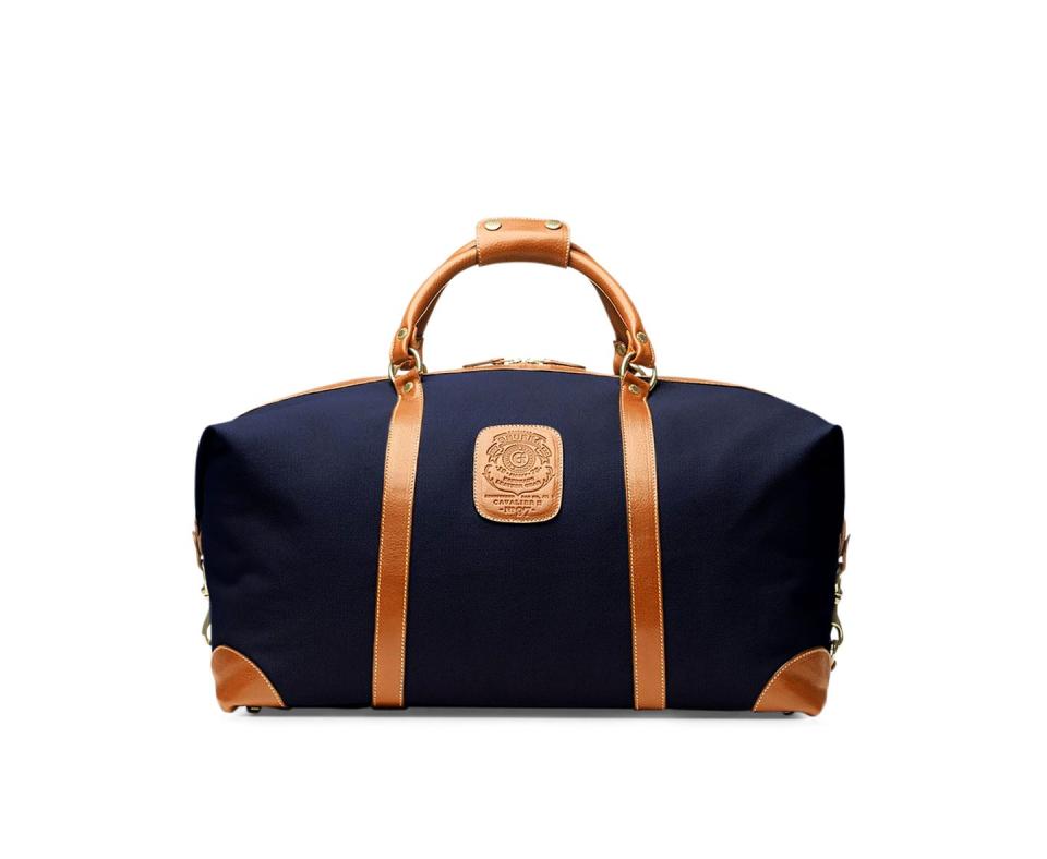 blue overnight bag with leather straps