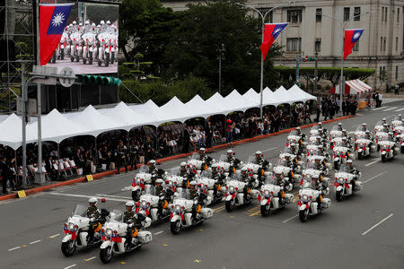 Military police perform on their motorcycles during the National Day celebrations in Taipei, Taiwan October 10, 2018. REUTERS/Tyrone Siu