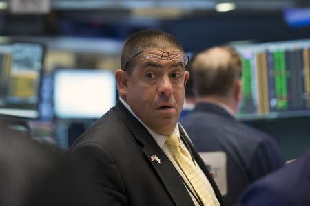 A trader works on the floor of the New York Stock Exchange August 25, 2015. REUTERS/Brendan McDermid