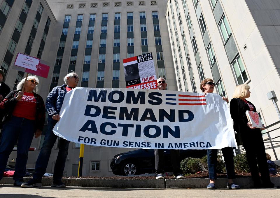 Demonstrators protest against gun violence in front of the Cordell Hull Building Tuesday, March 28, 2023, in Nashville, Tenn., after mass shooting Monday at Covenant School. 