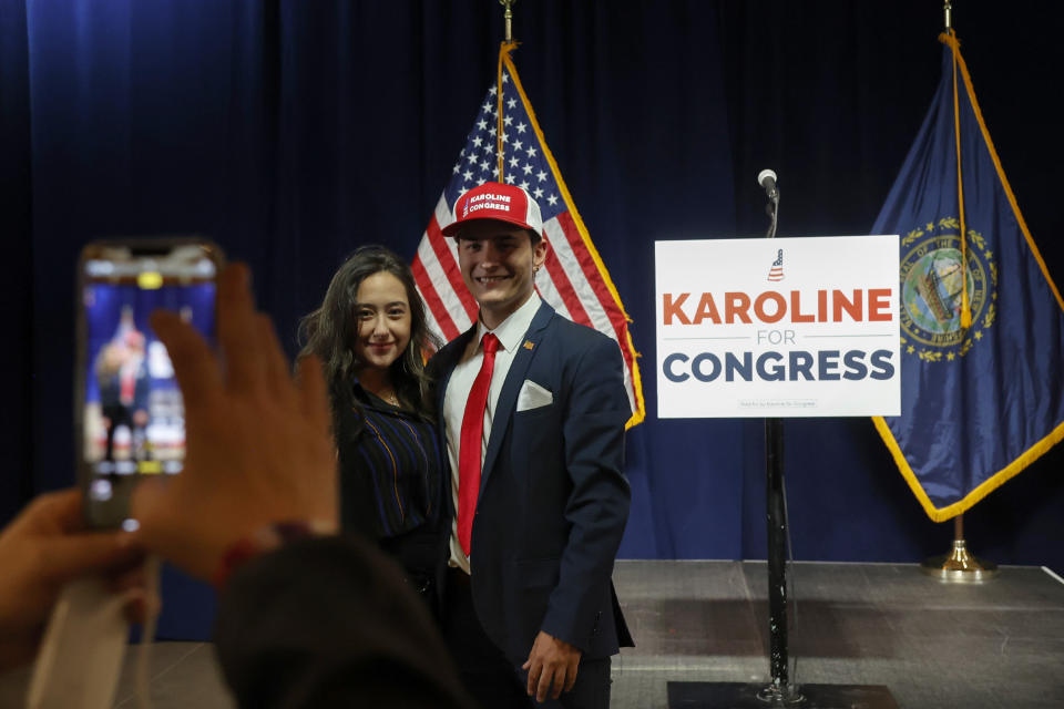 Dylan Quattrucci, right, and Erica Radzik, of Concord, N.H., pose for a photo at the election watch party for New Hampshire Republican 1st Congressional District candidate Karoline Leavitt at Wentworth by the Sea Country Club, Tuesday, Nov. 8, 2022, in Rye, N.H. (AP Photo/Mary Schwalm)
