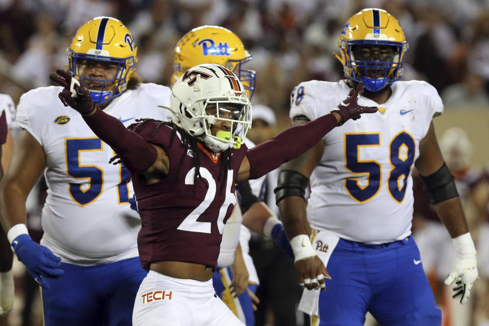 Virginia Tech defender Jalen Stroman (26) celebrates a Pittsburgh missed field goal during the second quarter of an NCAA college football game Saturday, Sept. 30, 2023, in Blacksburg, Va. (Matt Gentry/The Roanoke Times via AP)