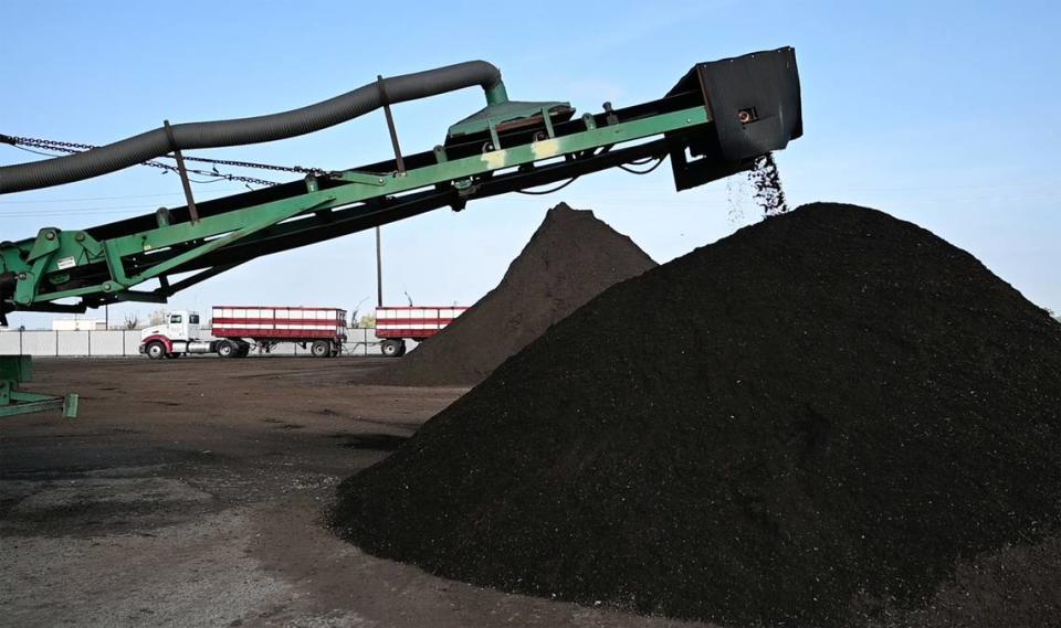 Compost is screened in the final step of the composting process at the City of Modesto Compost Facility west of Modesto, Calif., on Wednesday, Nov. 17, 2021.