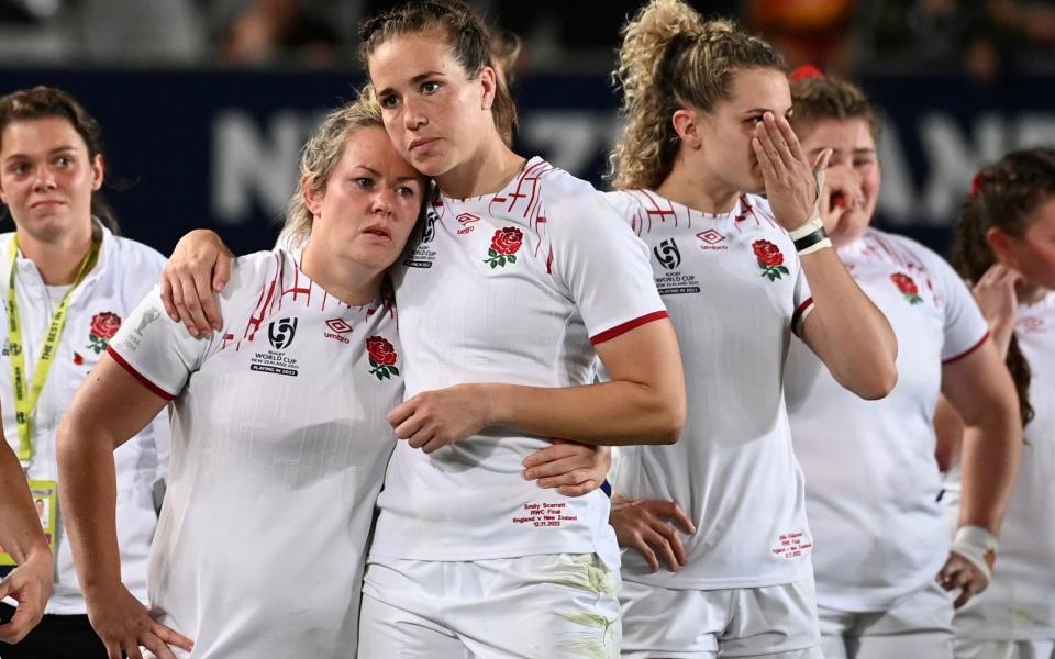 England players console each other after their loss to New Zealand in the Women's Rugby World Cup final at Eden Park in Auckland, New Zealand, Saturday, November 12, 2022.