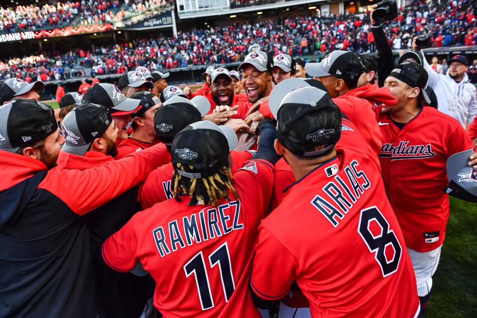 Guardians players celebrate the win.