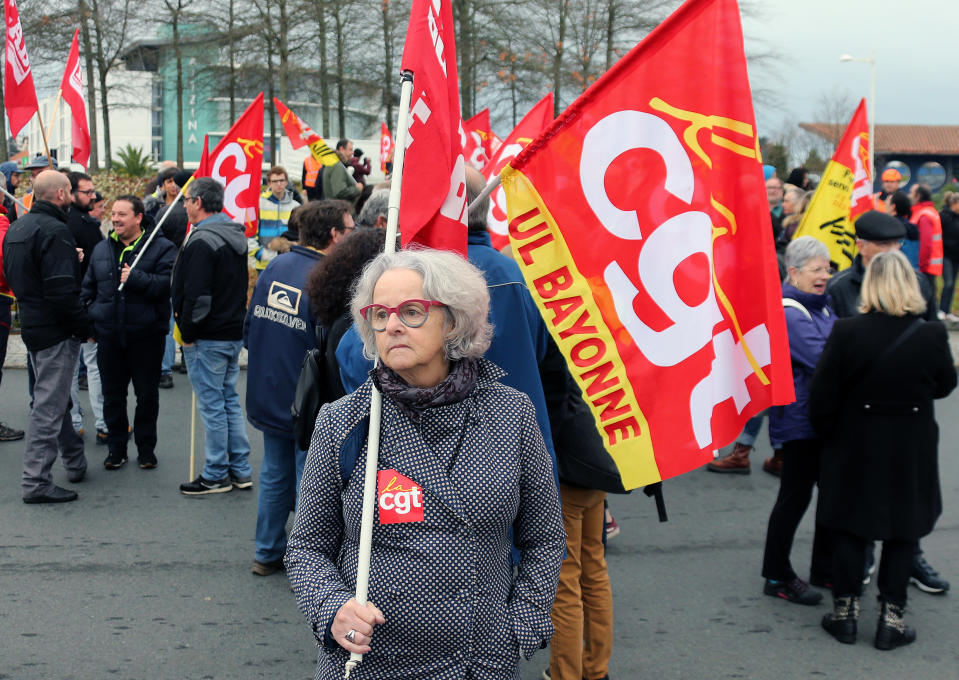 Trade union demonstrators protest in Anglet southwestern France, Saturday Dec. 7, 2019. Strikes disrupted weekend travel around France on Saturday as truckers blocked highways and most trains remained at a standstill because of worker anger at President Emmanuel Macron's policies. (AP Photo/Bob Edme)