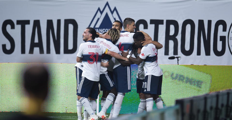 The Vancouver Whitecaps celebrate Fredy Montero's goal against the Montreal Impact during second half MLS soccer action in Vancouver, B.C. Wednesday, September, 16, 2020. THE CANADIAN PRESS/Jonathan Hayward/The Canadian Press via AP)during the second half of an MLS soccer match Wednesday, Sept. 16, 2020, in Vancouver, British Columbia. (Jonathan Hayward/The Canadian Press via AP)