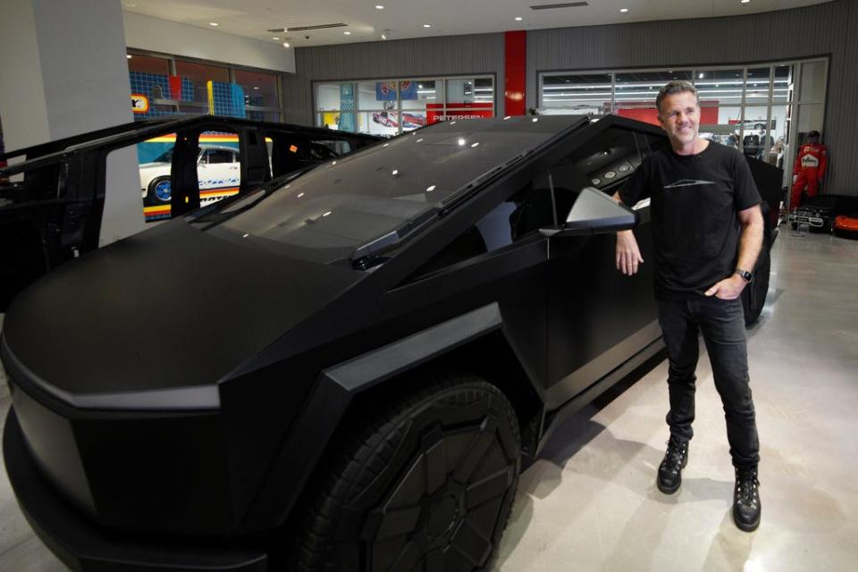 An image of a Tesla Cybertruck with a matte black finish.