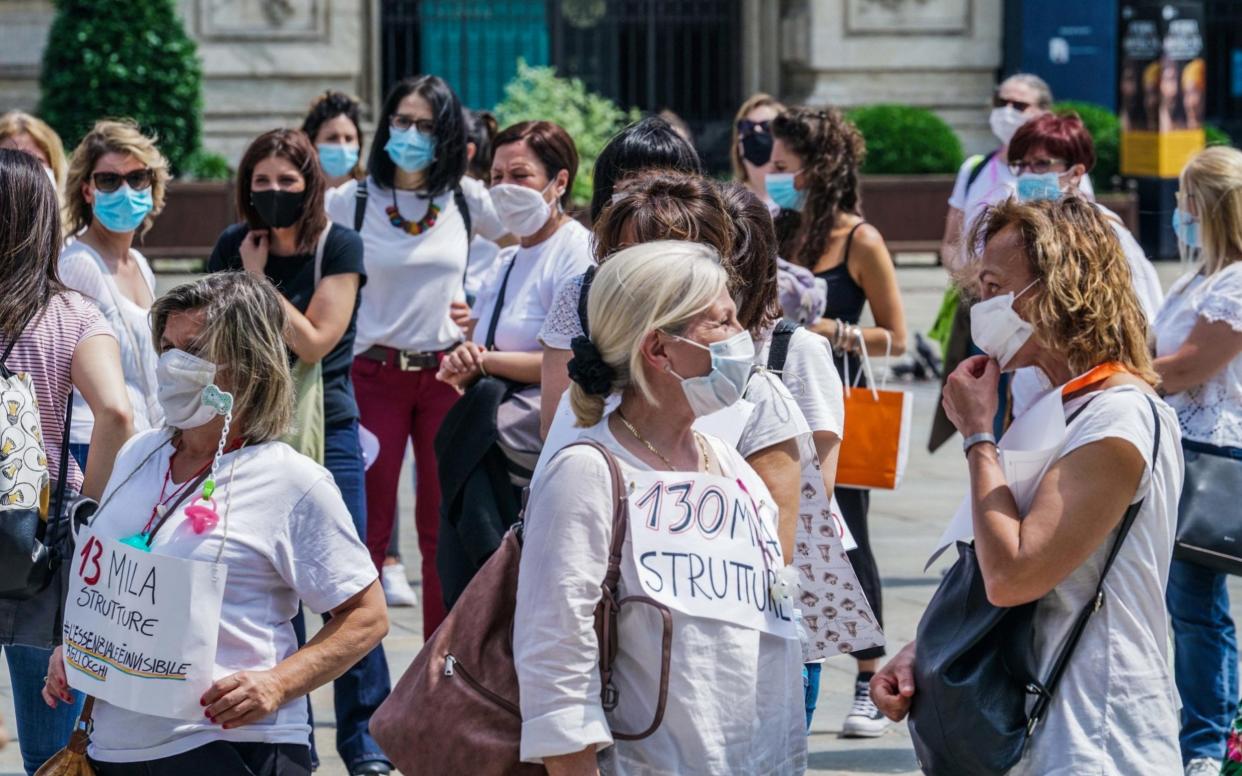 Childcare employees protest in Piazza Castello city square in Turin, northern Italy - Shutterstock