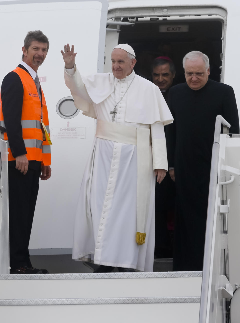 Pope Francis arrives at Milan's Linate airport, northern Italy, for a one-day pastoral visit to Monza and Milan, Italy’s second-largest city, Saturday, March 25, 2017. On Friday Francis welcomed 27 EU leaders to the Vatican on the eve of a summit to mark the 60th anniversary of the Treaty of Rome, the founding charter of the bloc. (AP Photo/Luca Bruno)