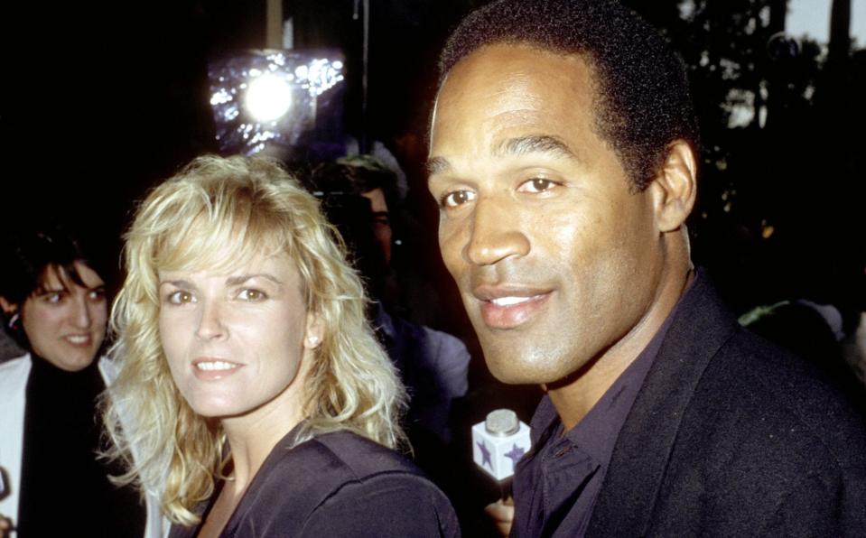 O.J. Simpson and Nicole Brown Simpson during Premiere of "When Harry Met Sally" at Academy Theater in Los Angeles, California, United States