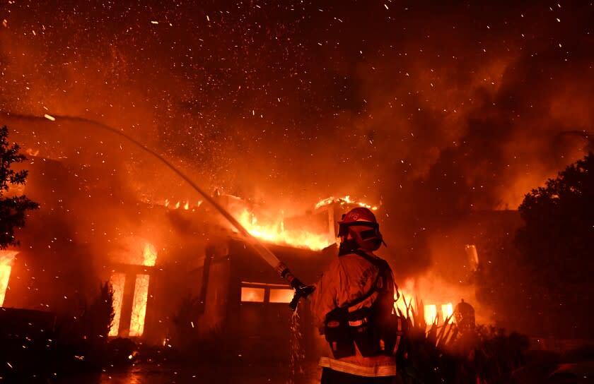 Laguna Niguel, California May 11, 2022- Firefighters battle the Coastal fire at Coronado Pointe in Laguna Niguel Wednesday. (Wally Skalij/Los Angeles Times)