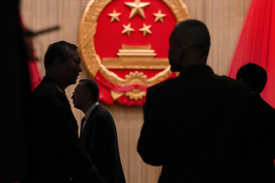 Delegates arrive for the closing session of the National People's Congress (NPC) at the Great Hall of the People in Beijing, Monday, March 11, 2024. (AP Photo/Andy Wong)