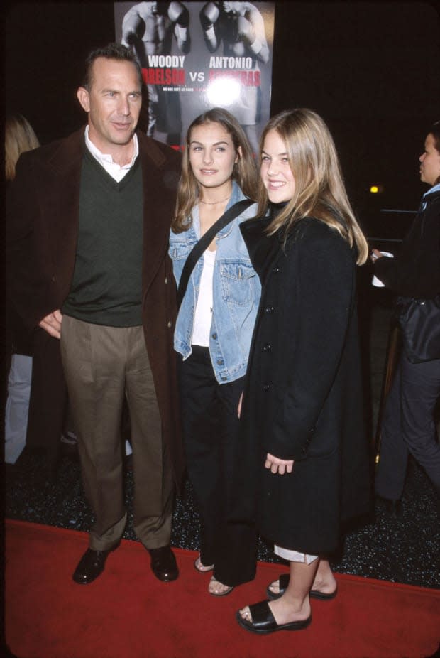 <p>Kevin Costner and older daughters Annie and Lily during the premiere of Play it to the Bone in Hollywood at the El Captain Theatre. </p>