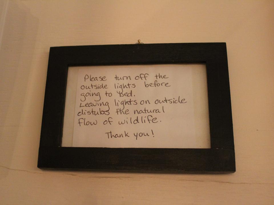 a sign for guests telling them to shut lights off before going to bed