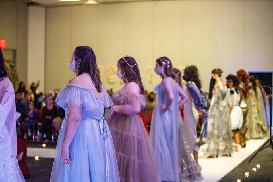 Models on the runway in 2022 wearing designs by Anjali Phougat and Hannah Ferguson. From left to right: Gabby Delprete, Ambrosia Havan, and Ashley McCoubrey.