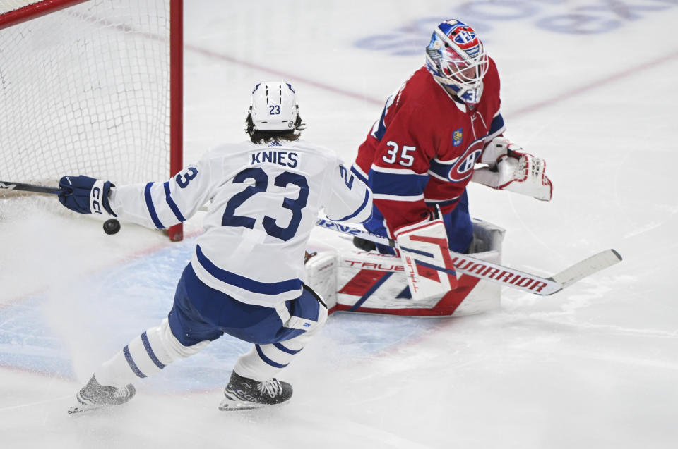 Toronto Maple Leafs' Matthew Knies (23) reacts to a goal by teammate Bobby McMann on Montreal Canadiens goaltender Sam Montembeault during the second period of an NHL hockey game Saturday, March 9, 2024, in Montreal. (Graham Hughes/The Canadian Press via AP)