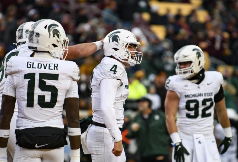 Sam Leavitt of the Michigan State Spartans celebrates after throwing a touchdown pass in the fourth quarter against the Minnesota Golden Gophers at Huntington Bank Stadium on October 28, 2023 in Minneapolis, Minnesota.