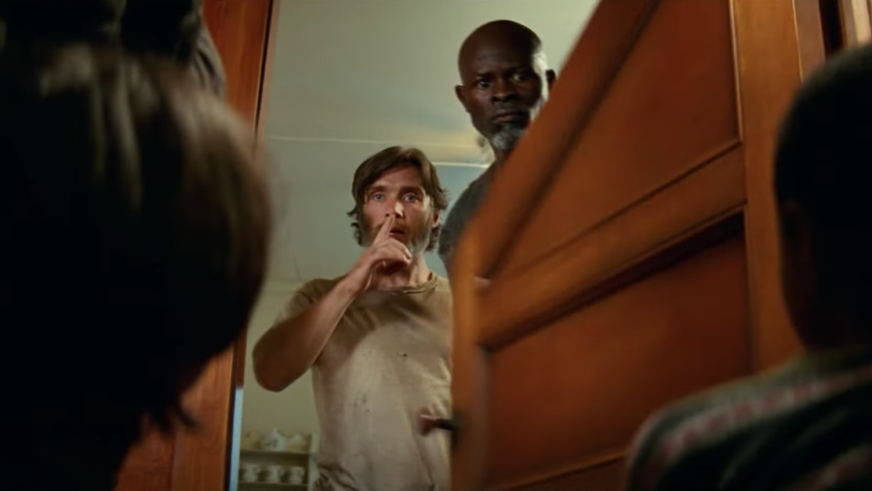 Cillian Murphy shushing and Djimon Honsou in A Quiet Place Part II.