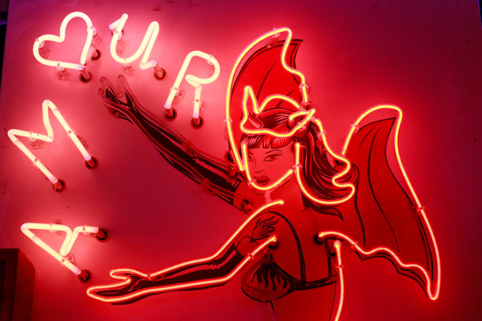 A neon sign that reads ‘Amour’