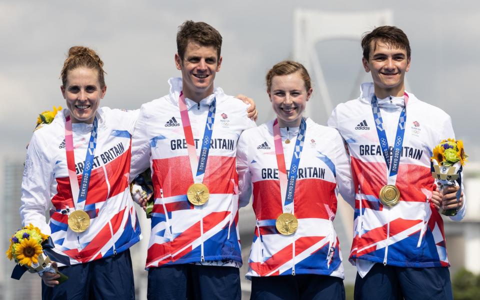 Jessica Learmonth, Jonathon Brownlee, Georgia Taylor-Brown and Alex Yee of Team Great Britain celebrate on the podium during the medal ceremony following the Mixed Relay Triathlon on day eight of the Tokyo 2020 Olympic Games at Odaiba Marine Park on July 31, 2021 in Tokyo, Japan -  Getty Images 