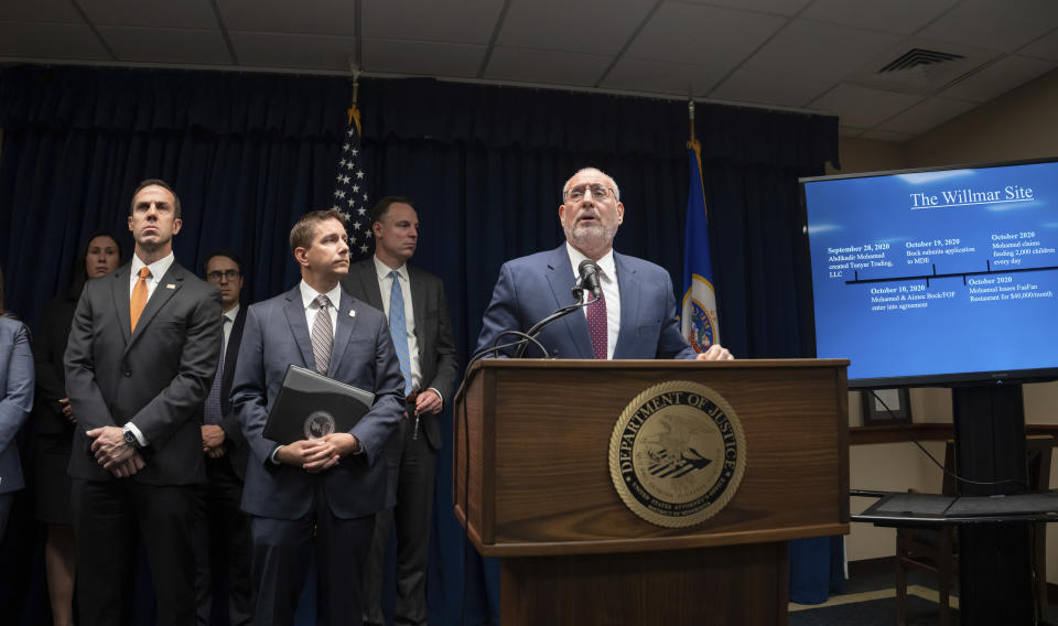 U.S. Attorney Andy Luger today announces a significant COVID-related fraud case based in Minnesota Tuesday, Sept. 20, 2022 Minneapolis, Minn. On the left are IRS Special Agent in Charge Justin Campbell and FBI Special Agent in Charge Michael Paul. (Glen Stubbe/Star Tribune via AP)