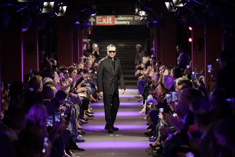 Fashion designer Tom Ford poses for photographs after his collection was modeled Monday, Sept. 9, 2019, in New York. (AP Photo/Frank Franklin II)