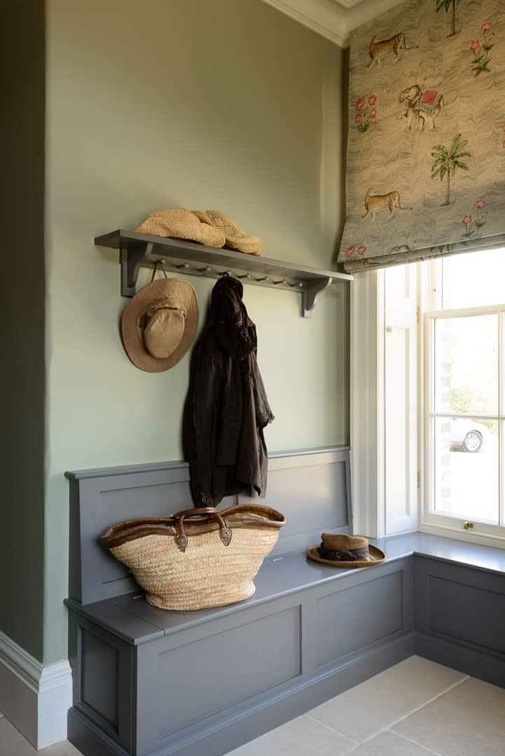 A storage bench with a lift-up lid is a mudroom must-have