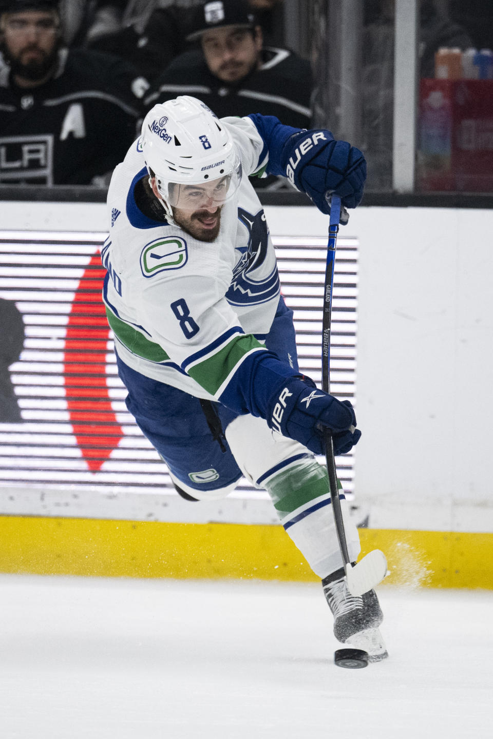 Vancouver Canucks right wing Conor Garland (8) shoots during the first period of an NHL hockey game against the Los Angeles Kings, Tuesday, March 5, 2024, in Los Angeles. (AP Photo/Kyusung Gong)